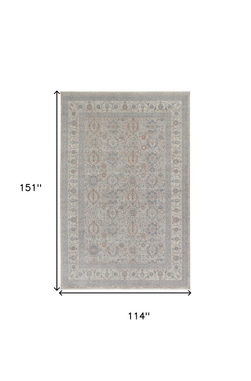 7' X 10' Silver Taupe and Blue Oriental Power Loom Worn Faded Area Rug With Fringe